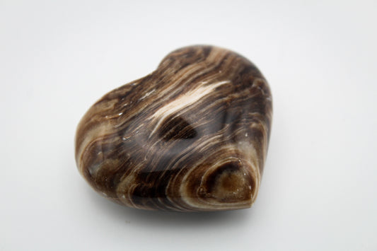 A polished chocolate calcite heart-shaped stone with a brown and white marbled pattern.