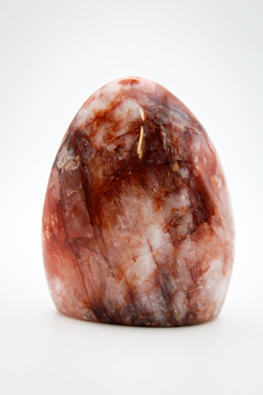 A polished red hematoid free form mineral.