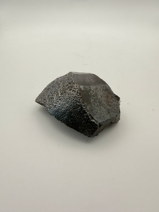 Small raw hematite specimen.