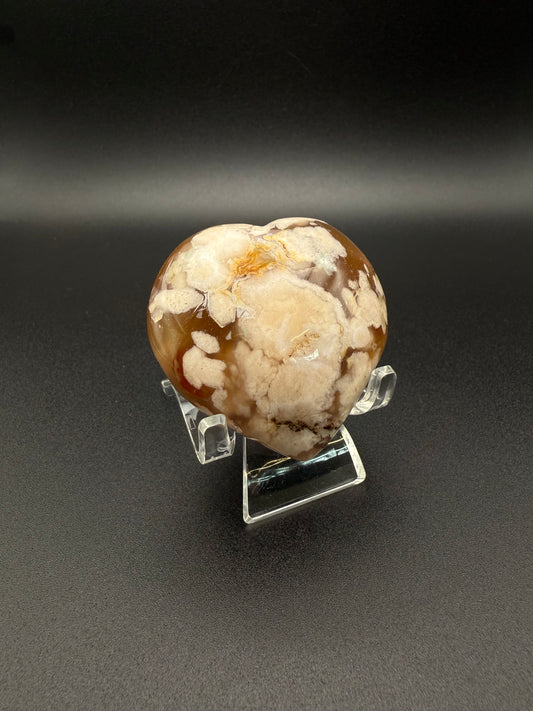 Flower Agate polished crystal in the shape of a heart.