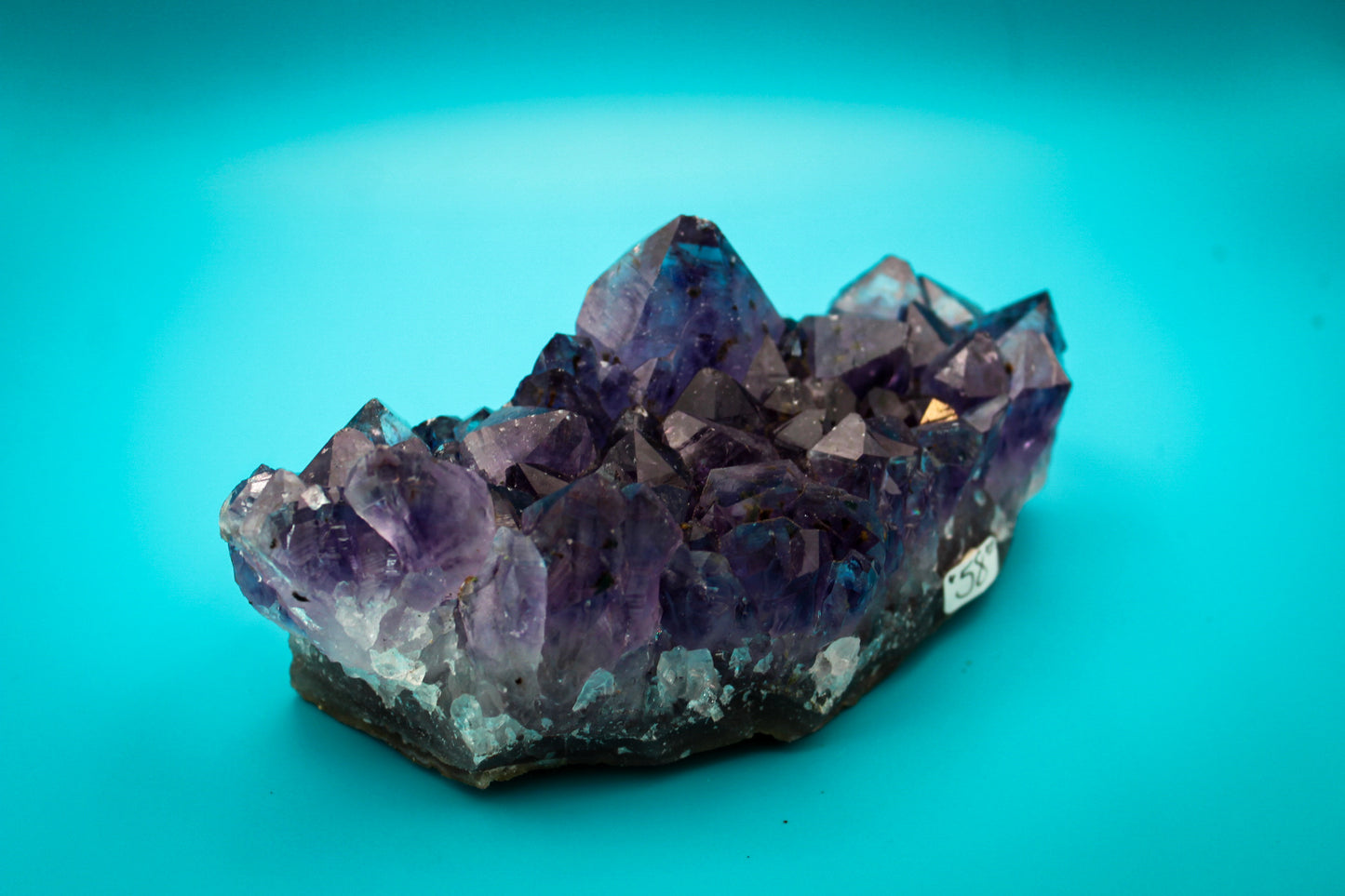 A cluster of amethyst crystals with a deep purple color.