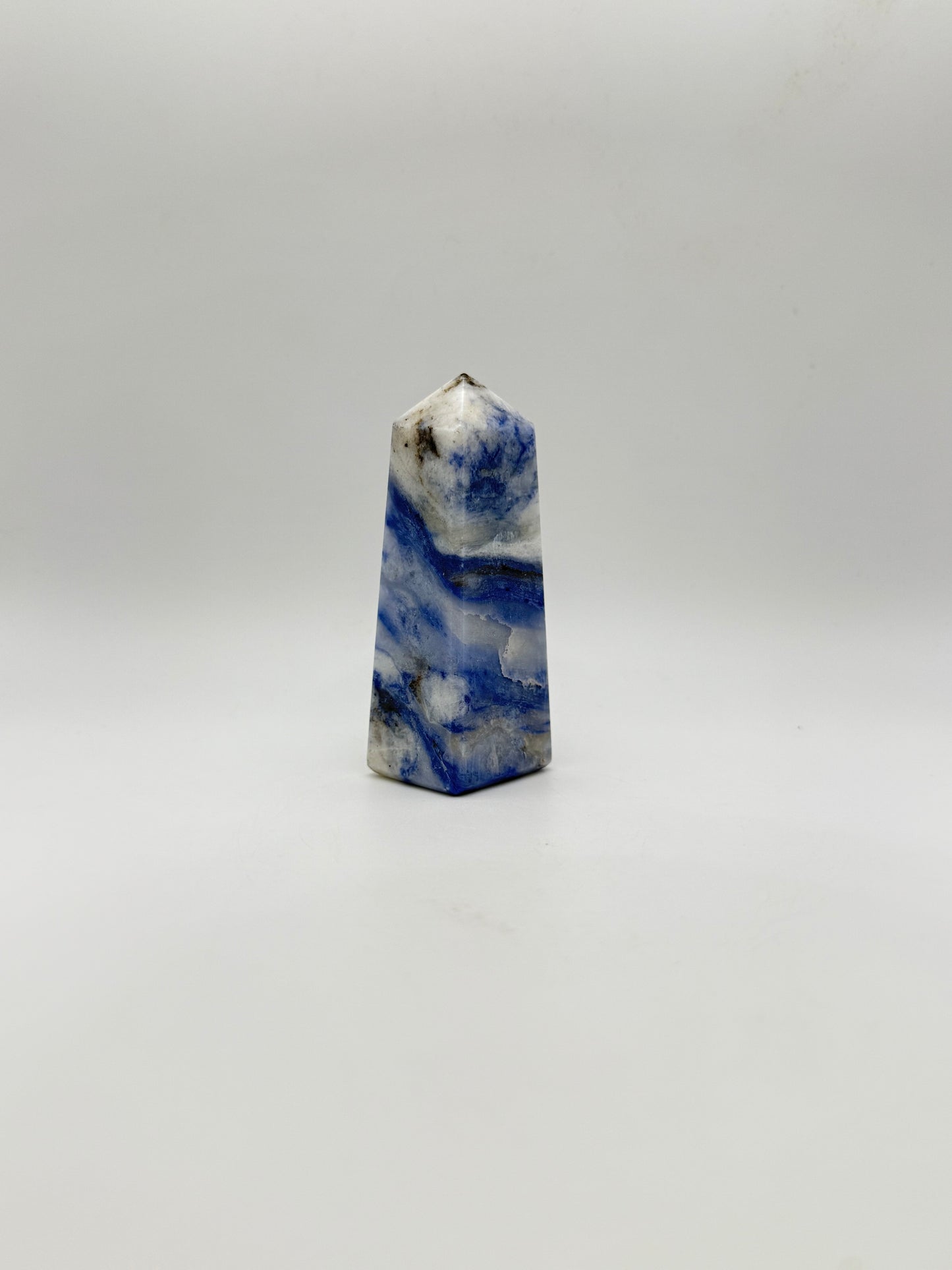 Afghanite four sided tower. Height of 3 1/4 inches, width of 1 1/4 inches.