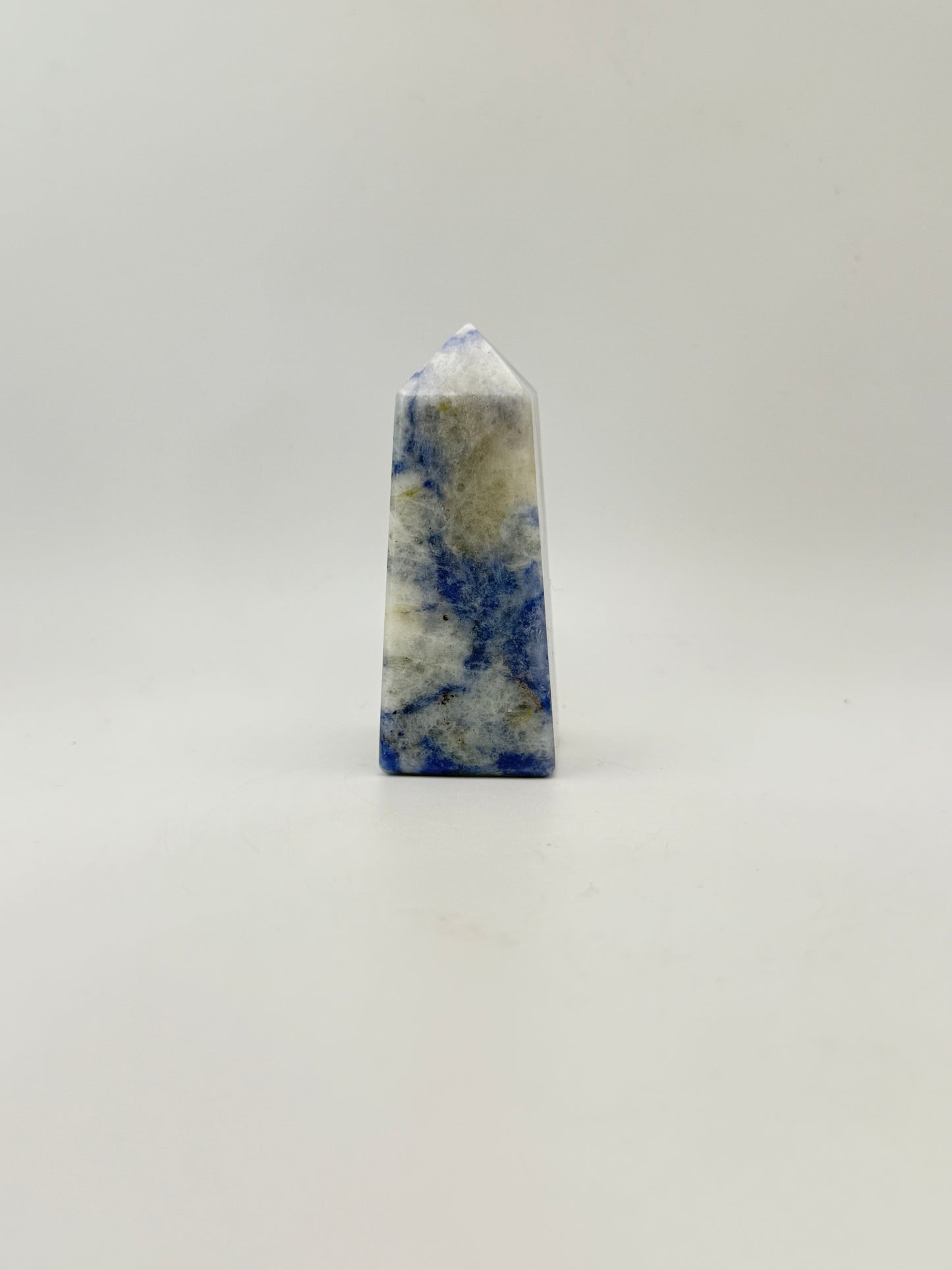 Afghanite four sided tower. Height of 3 inches, width of 1 1/8 inches.