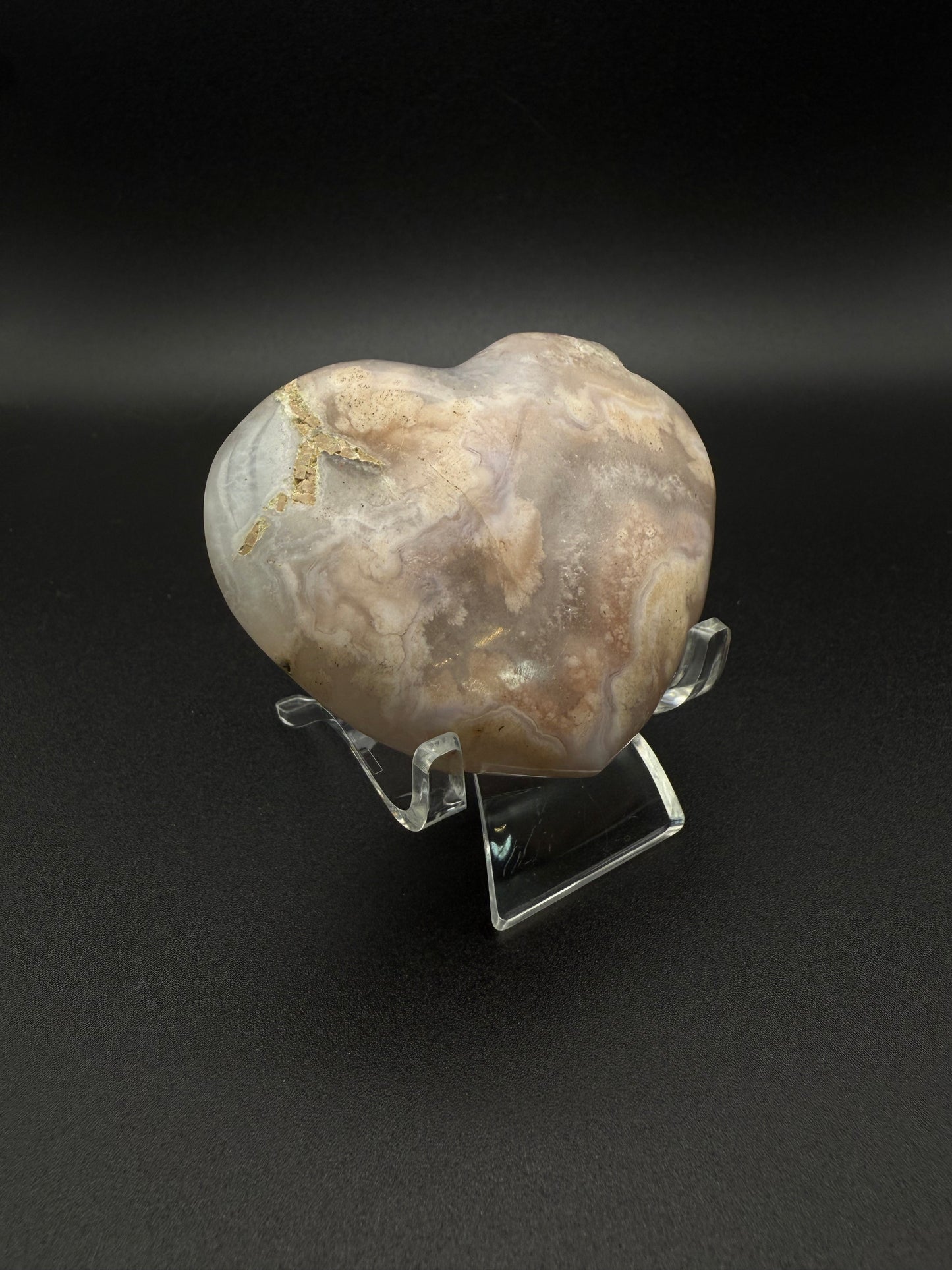 Heart-shaped polished flower agate crystal.