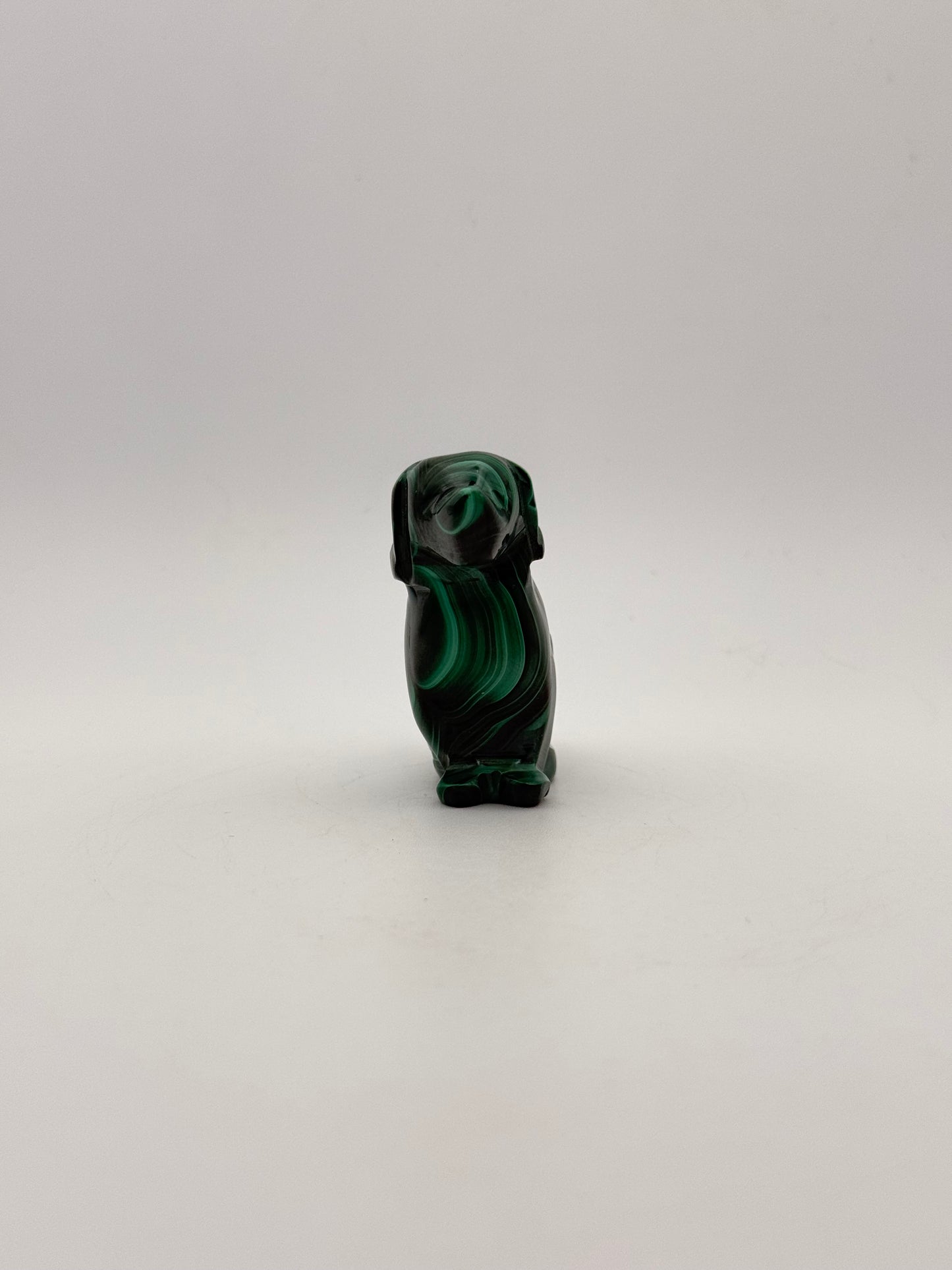 Polished malachite dog carving.