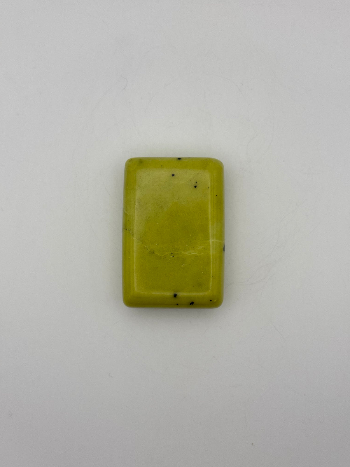 Polished healerite in the shape of a rectangular soap.