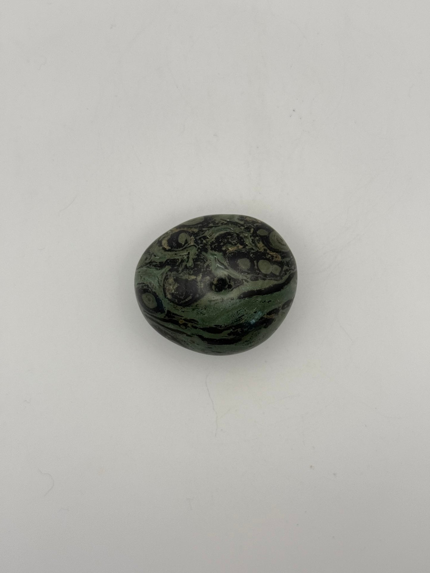 Polished kambaba jasper palm stone.