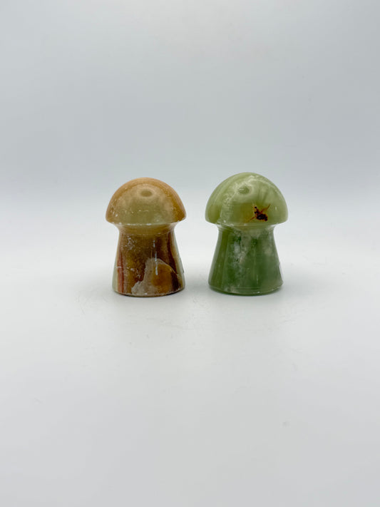 Two onyx mushroom-shaped stones.