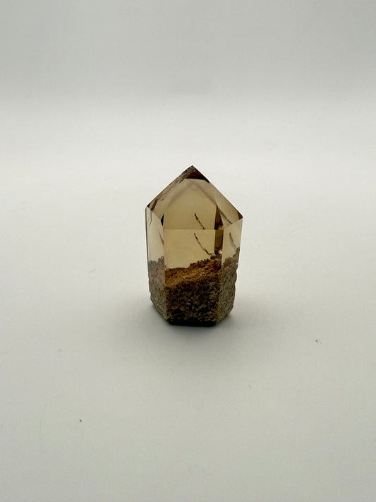 Polished natural citrine point.