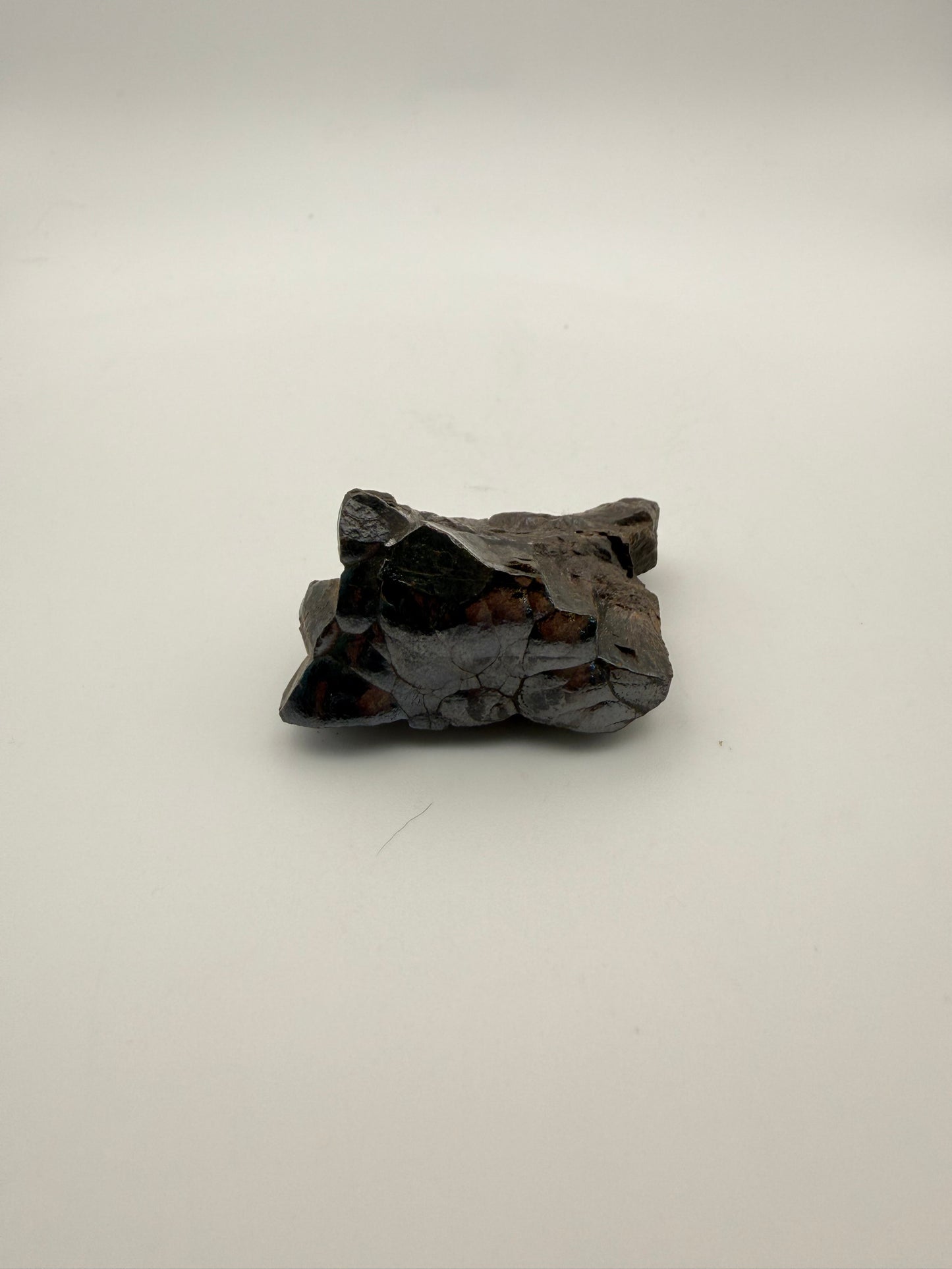 Small raw hematite specimen.