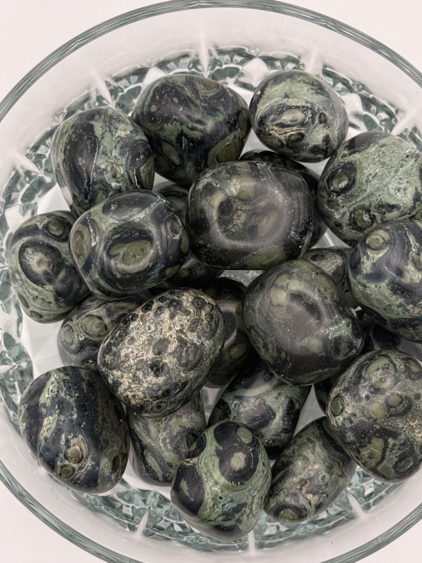 Close-up of polished kambaba jasper tumbles.