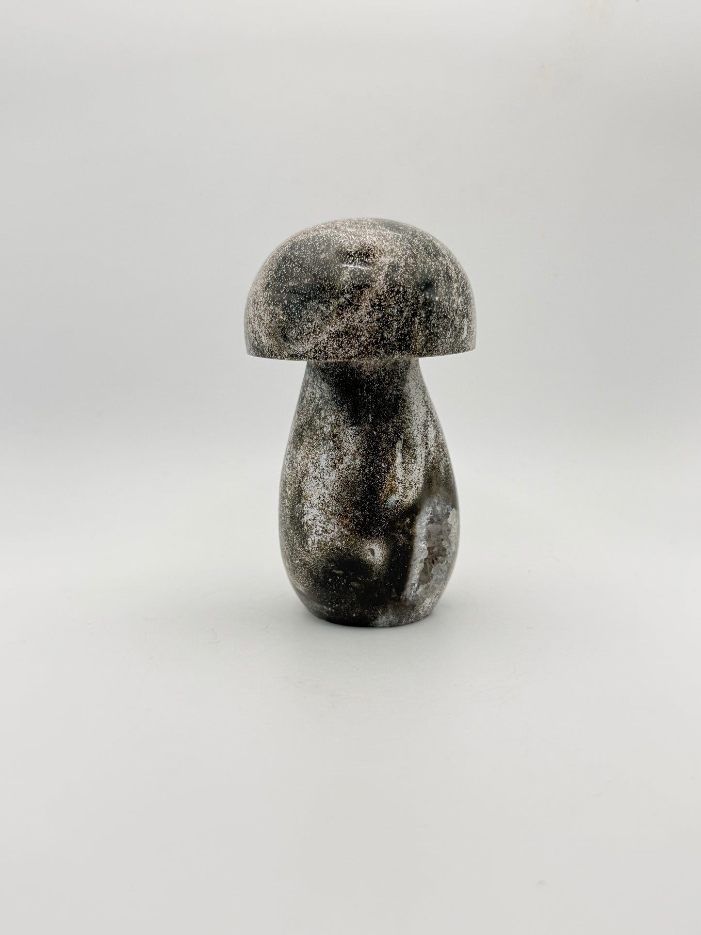 Ocean jasper stone in the shape of a mushroom.
