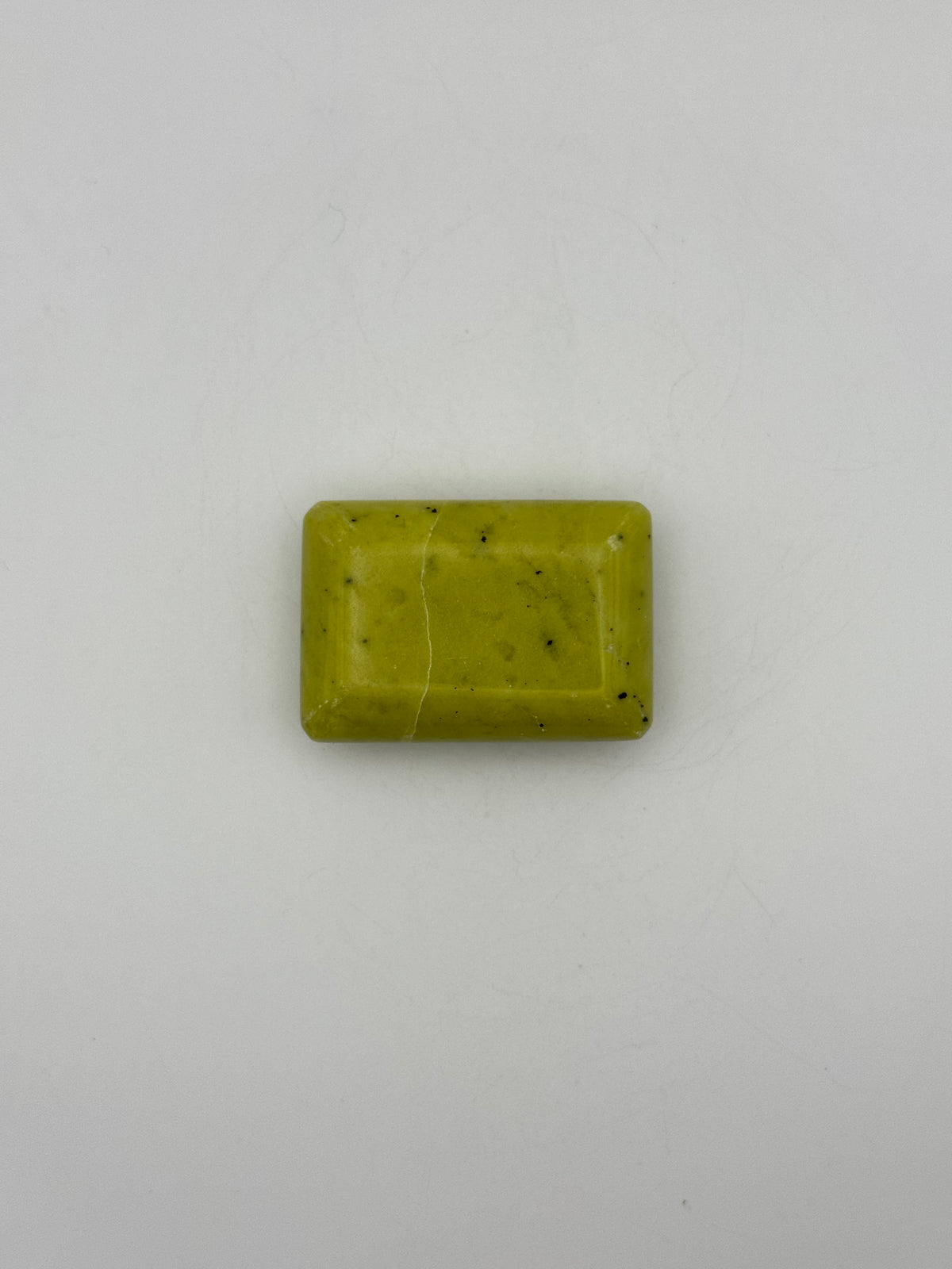 Polished healerite in the shape of a rectangular soap.