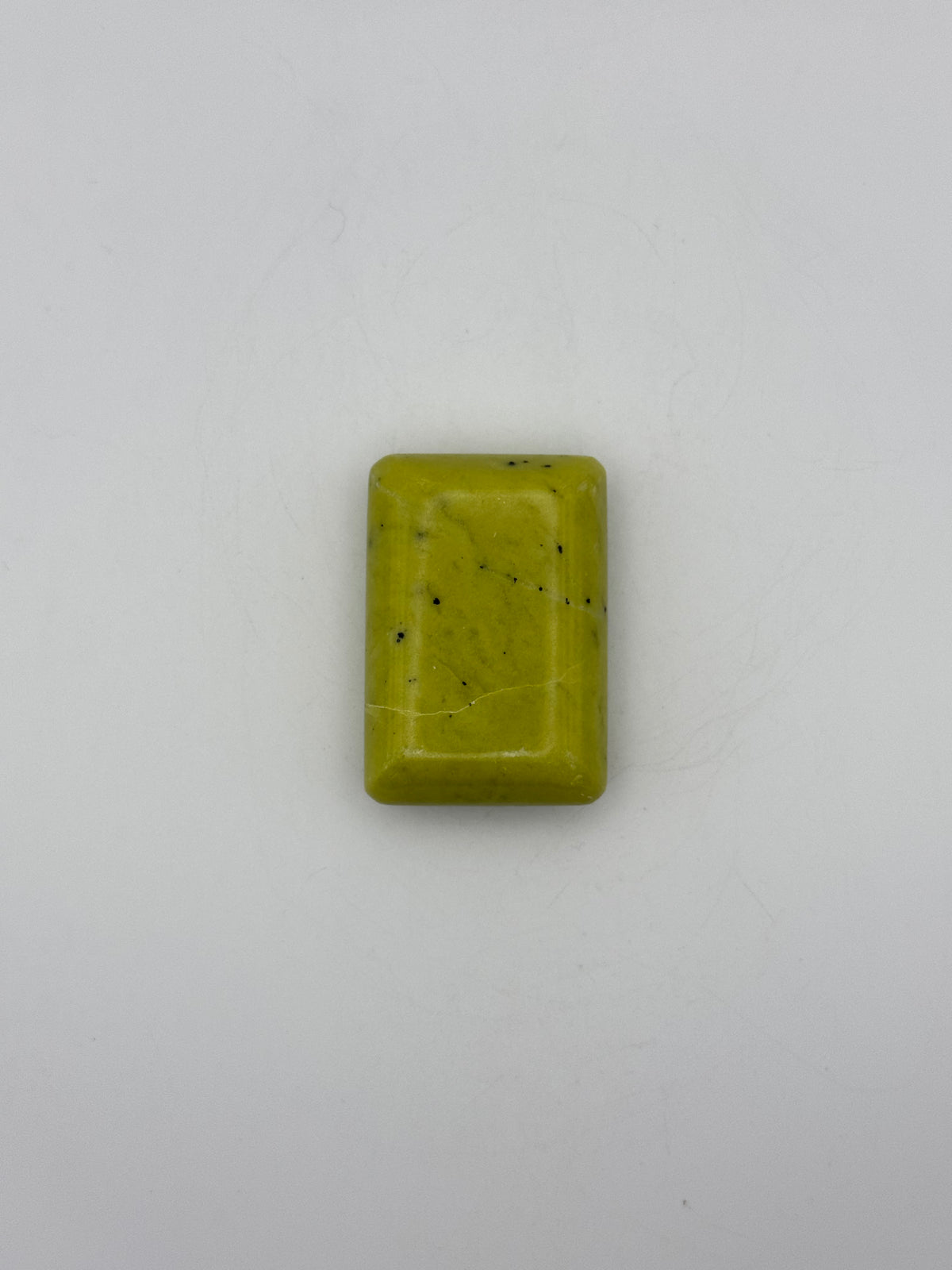 Polished healerite in the shape of a rectangular soap.