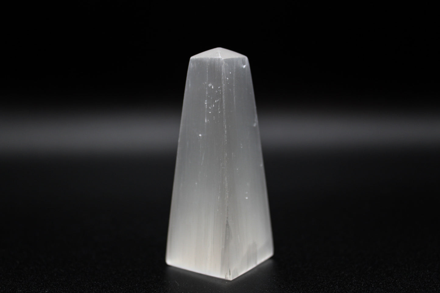 Selenite tower that is 6cm tall.