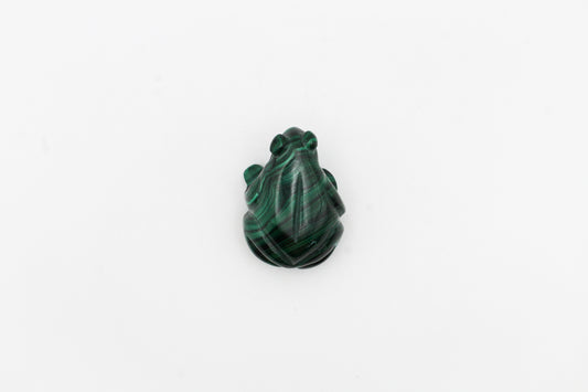 A small malachite stone sculpture of a frog with distinctive swirling patterns.