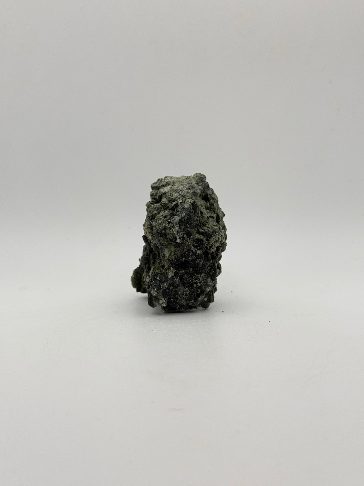 Raw prehnite specimen with amazing green color.