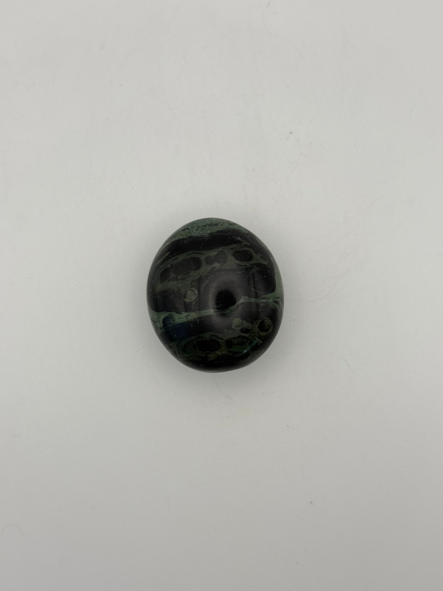 Polished kambaba jasper palm stone.