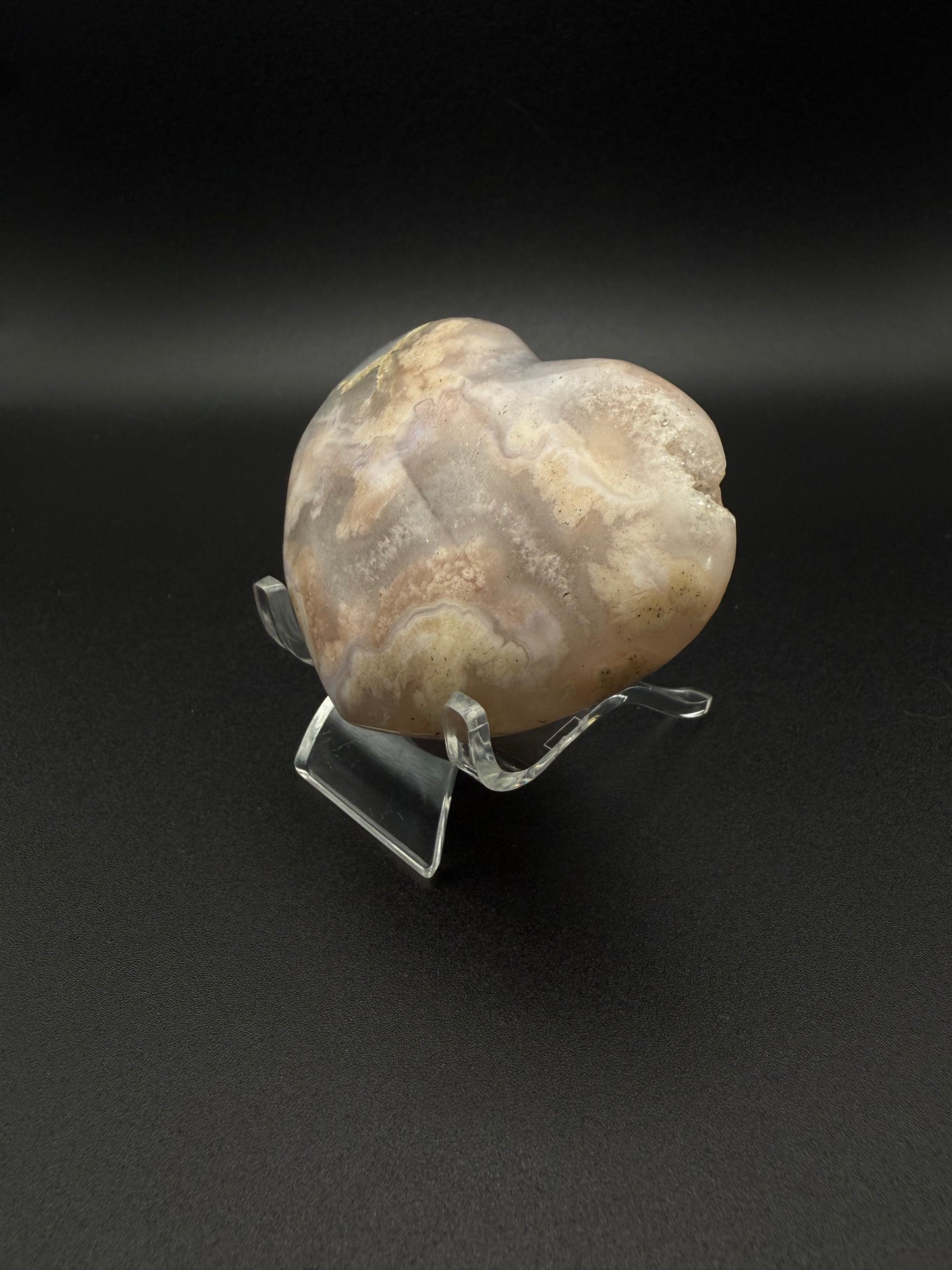 Heart-shaped polished flower agate crystal.