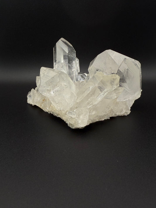 Large cluster of clear quartz crystals.