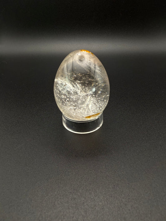 Clear quartz polished crystal thats egg shaped.
