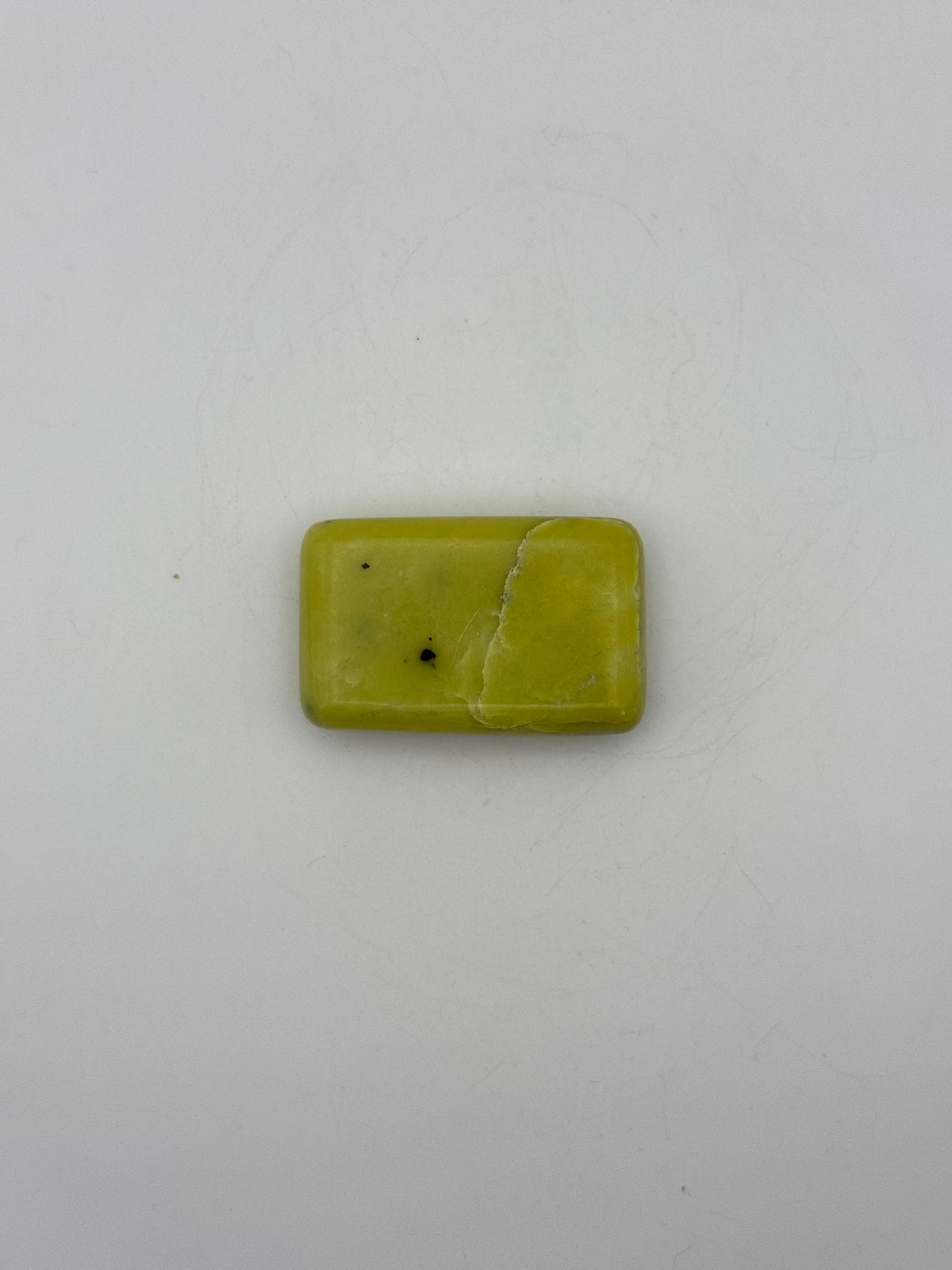 Polished healerite in the shape of a rectangular soap.