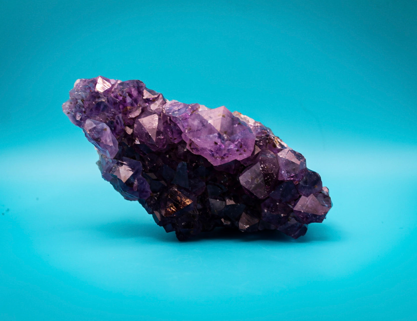 A cluster of amethyst crystals with a deep purple color.