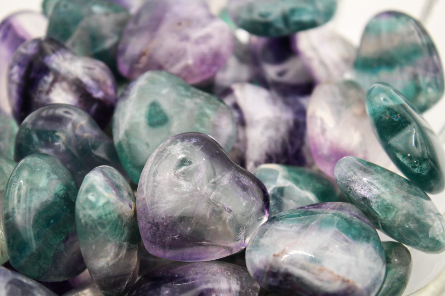 Rainbow fluorite heart shaped stones.