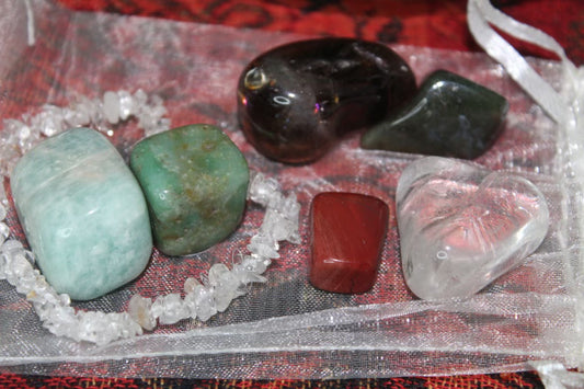Anxiety Bag. Clear quartz, smokey quartz, amazonite, poppy jasper, moss agate, and jade tumble with clear quartz bracelet.