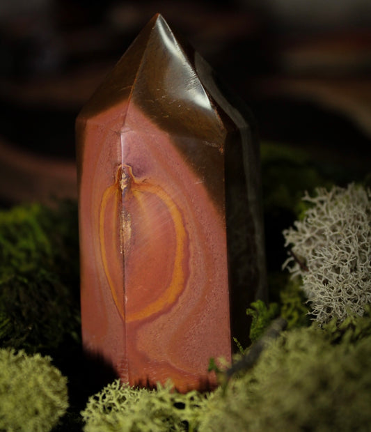 A polished polychrome jasper tower.