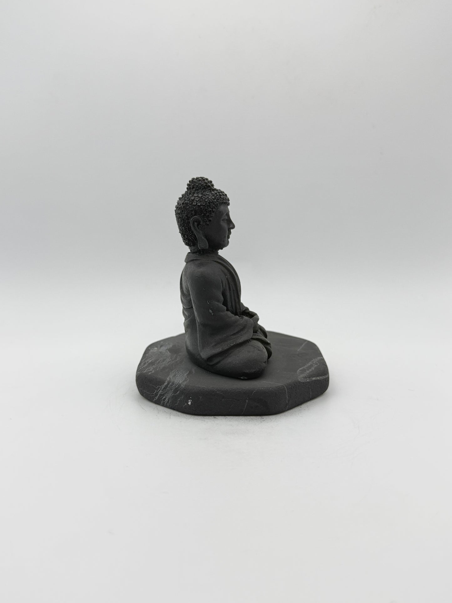 Shungite carving of a buddha.