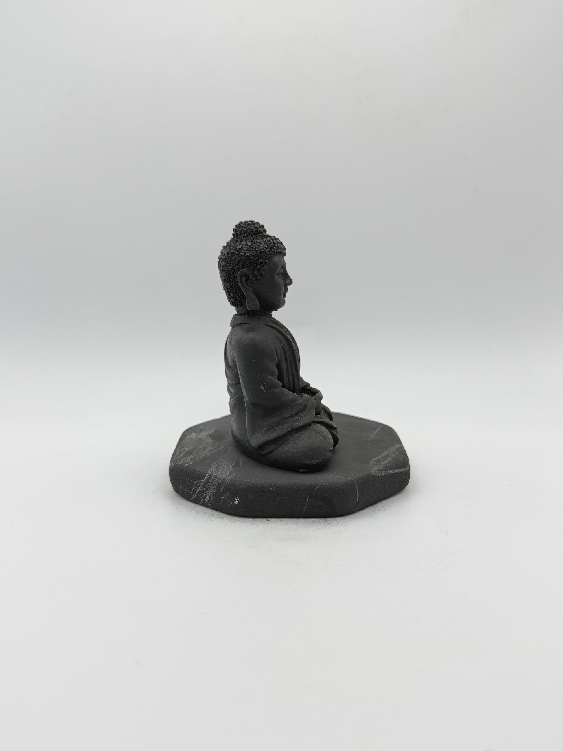 Shungite carving of a buddha.