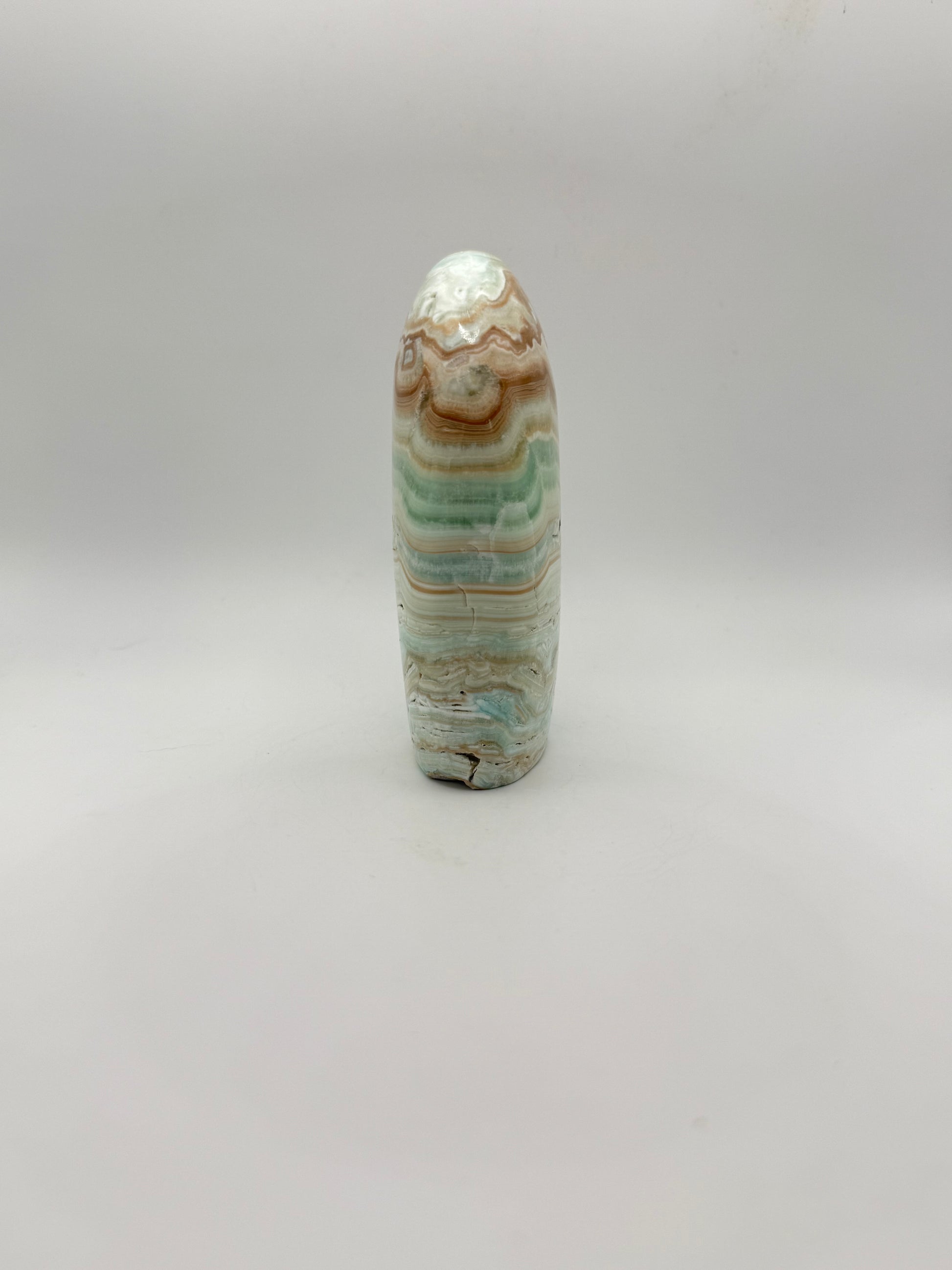 Caribbean calcite polished crystal free form in the shape of a dome.