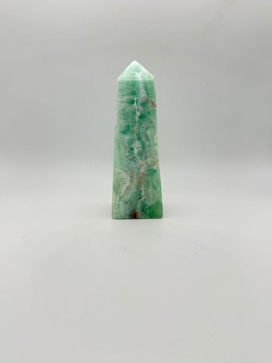 Caribbean Calcite polished four sided tower. This is 4.75 inches tall.