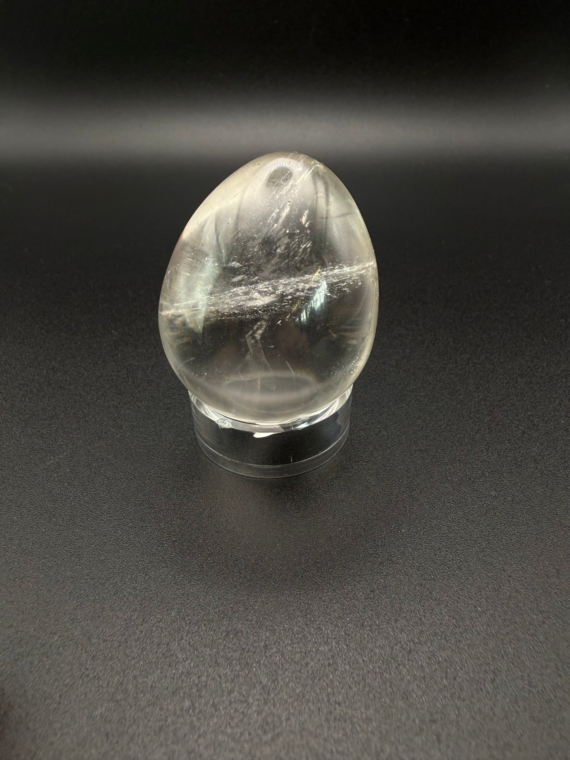 Clear quartz polished crystal in an egg shape.