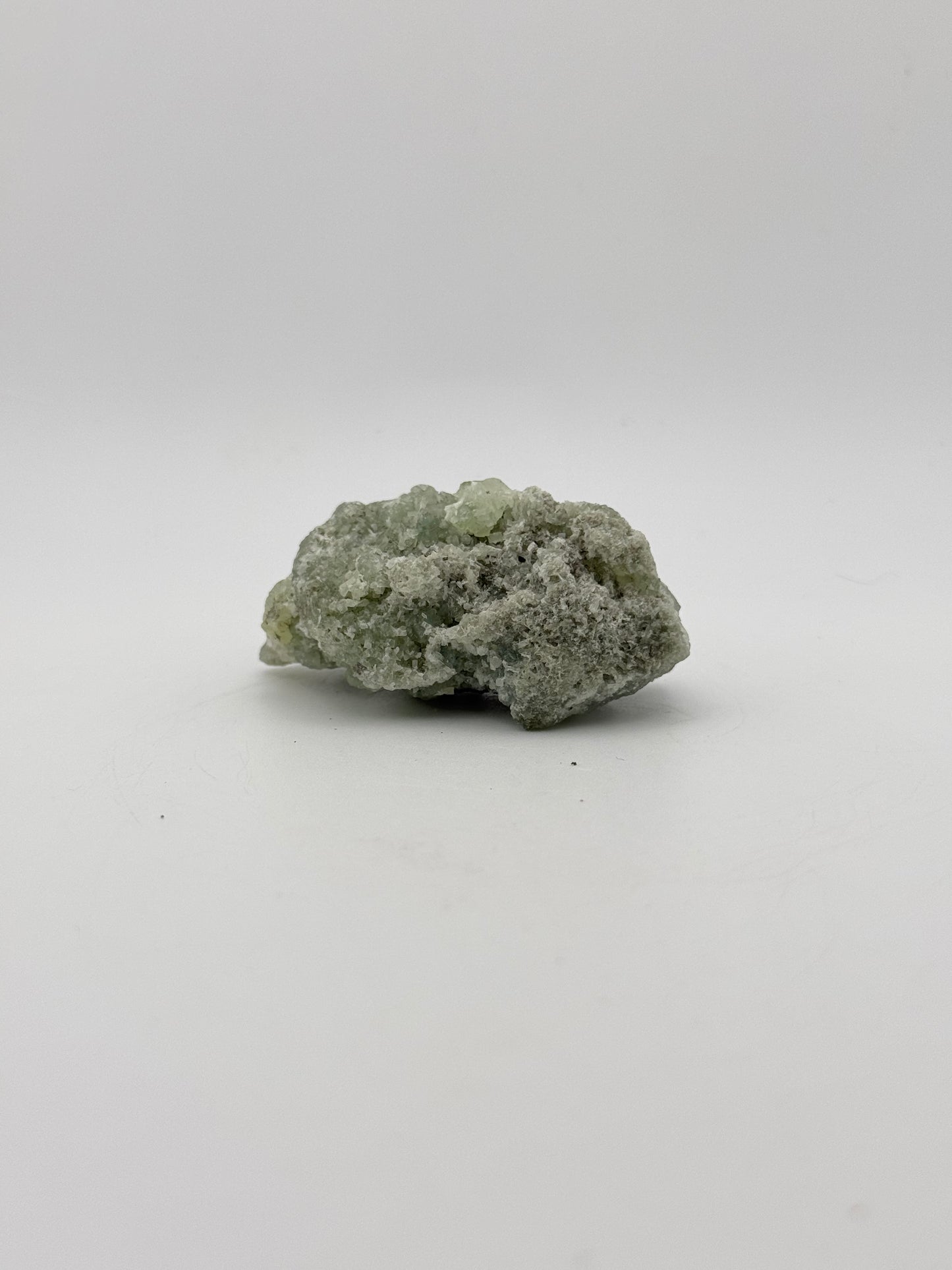 Raw Prehnite specimen with amazing green color.
