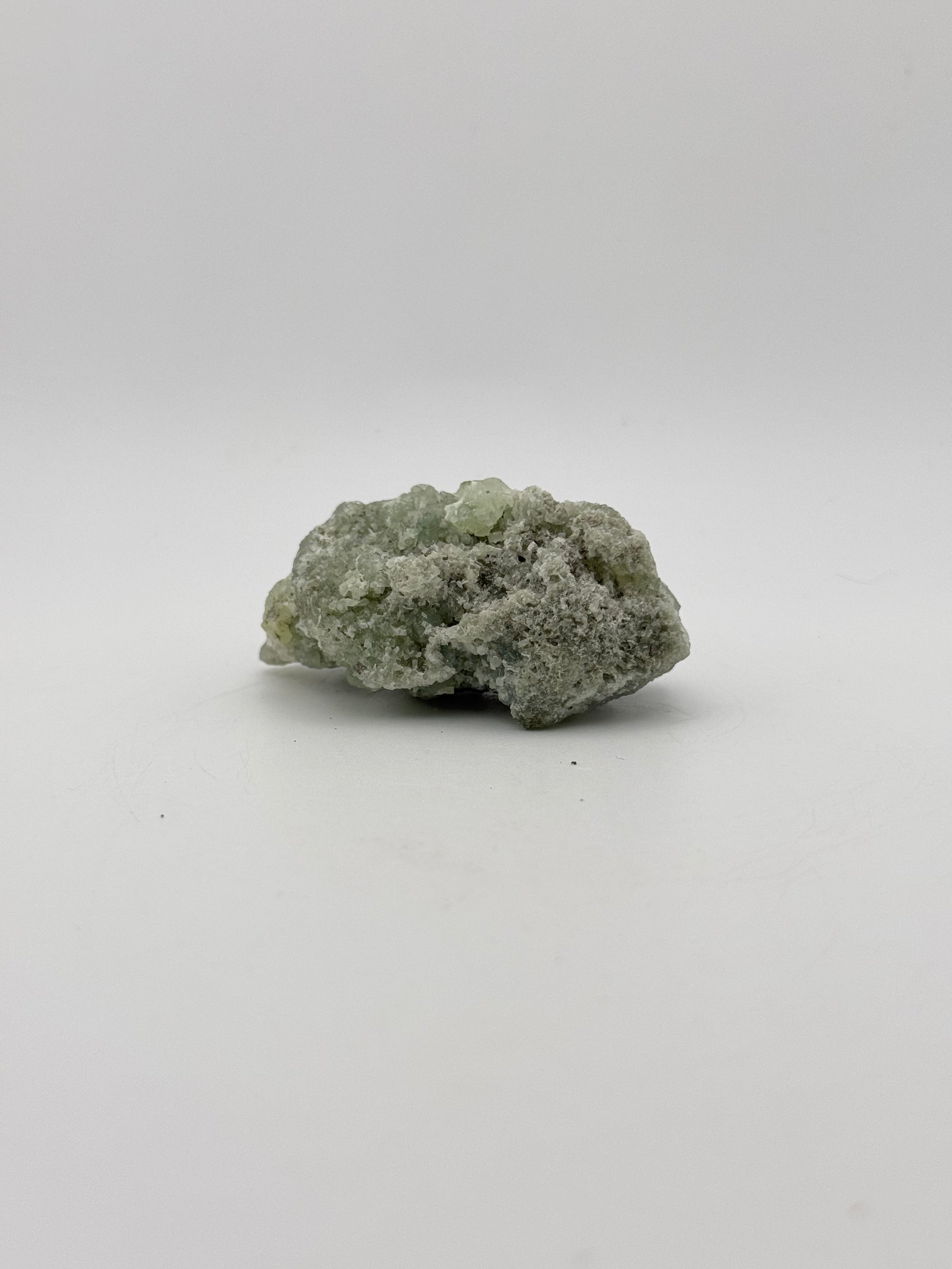 Raw Prehnite specimen with amazing green color.
