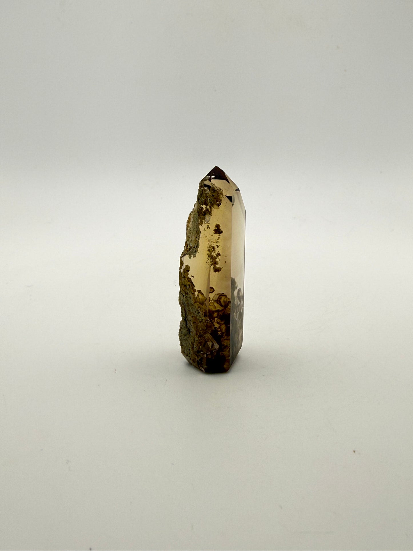 Polished natural citrine point.