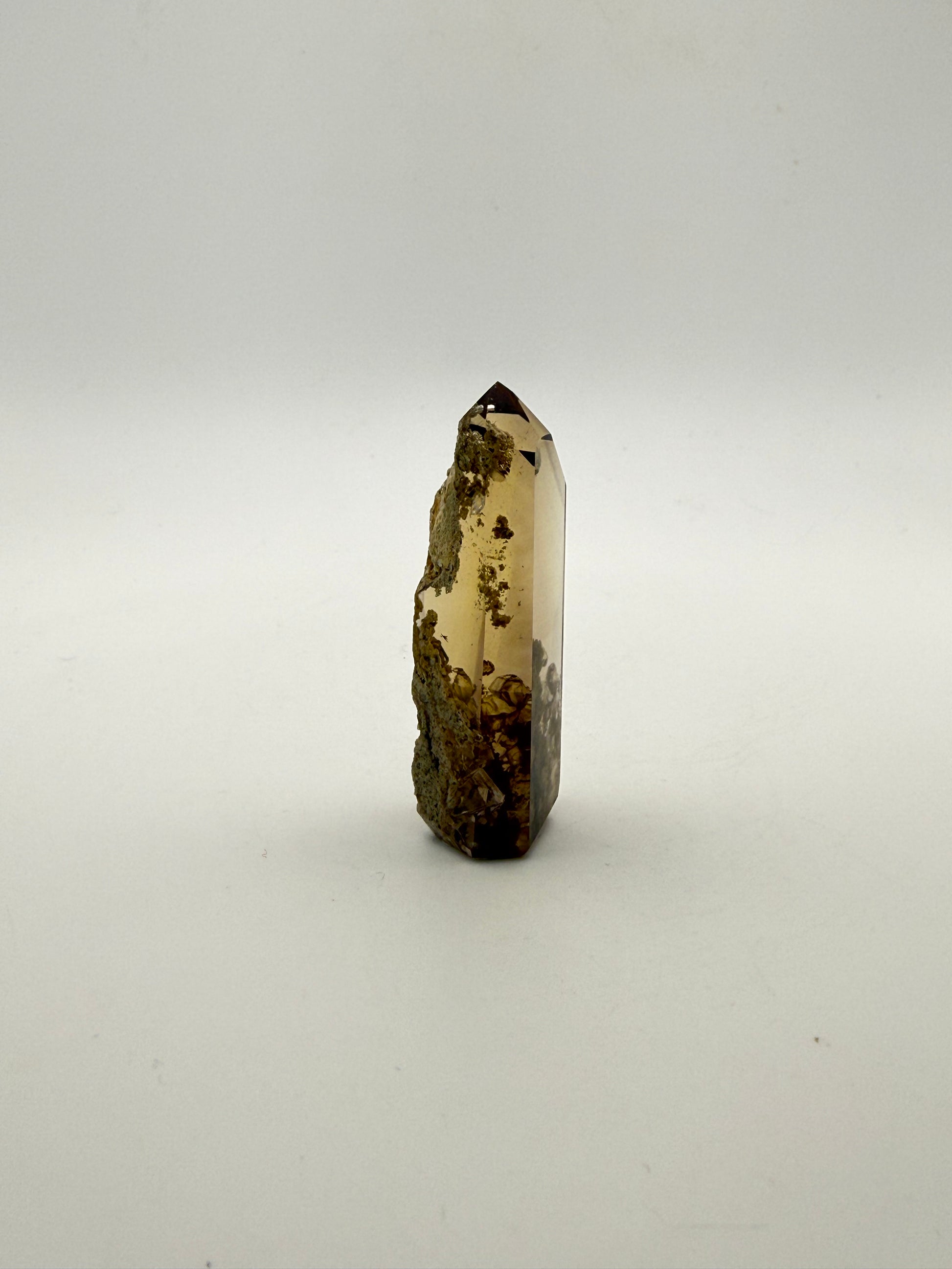 Polished natural citrine point.