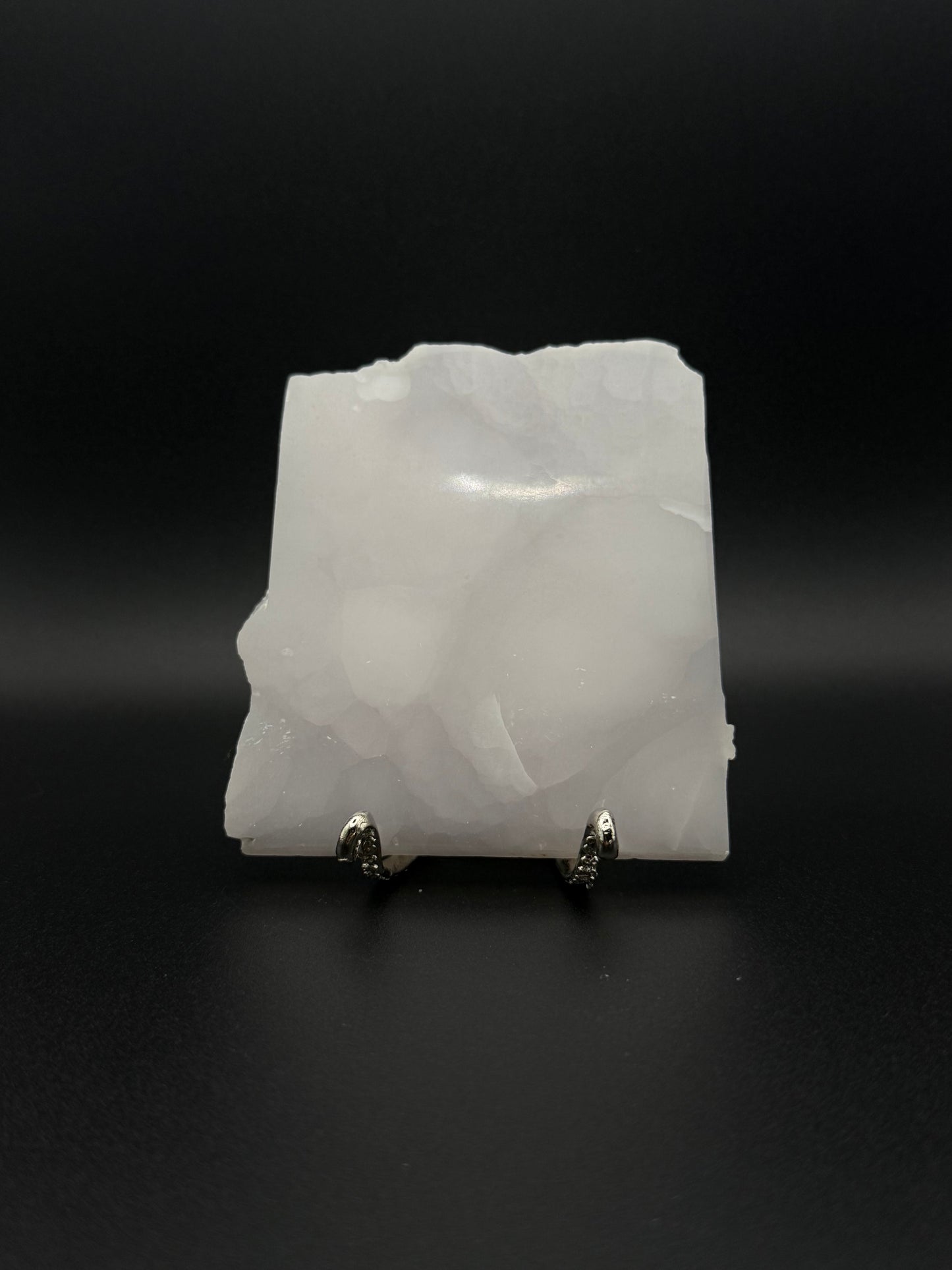 Polished pink calcite slab. Pink calcite glows under uv light.