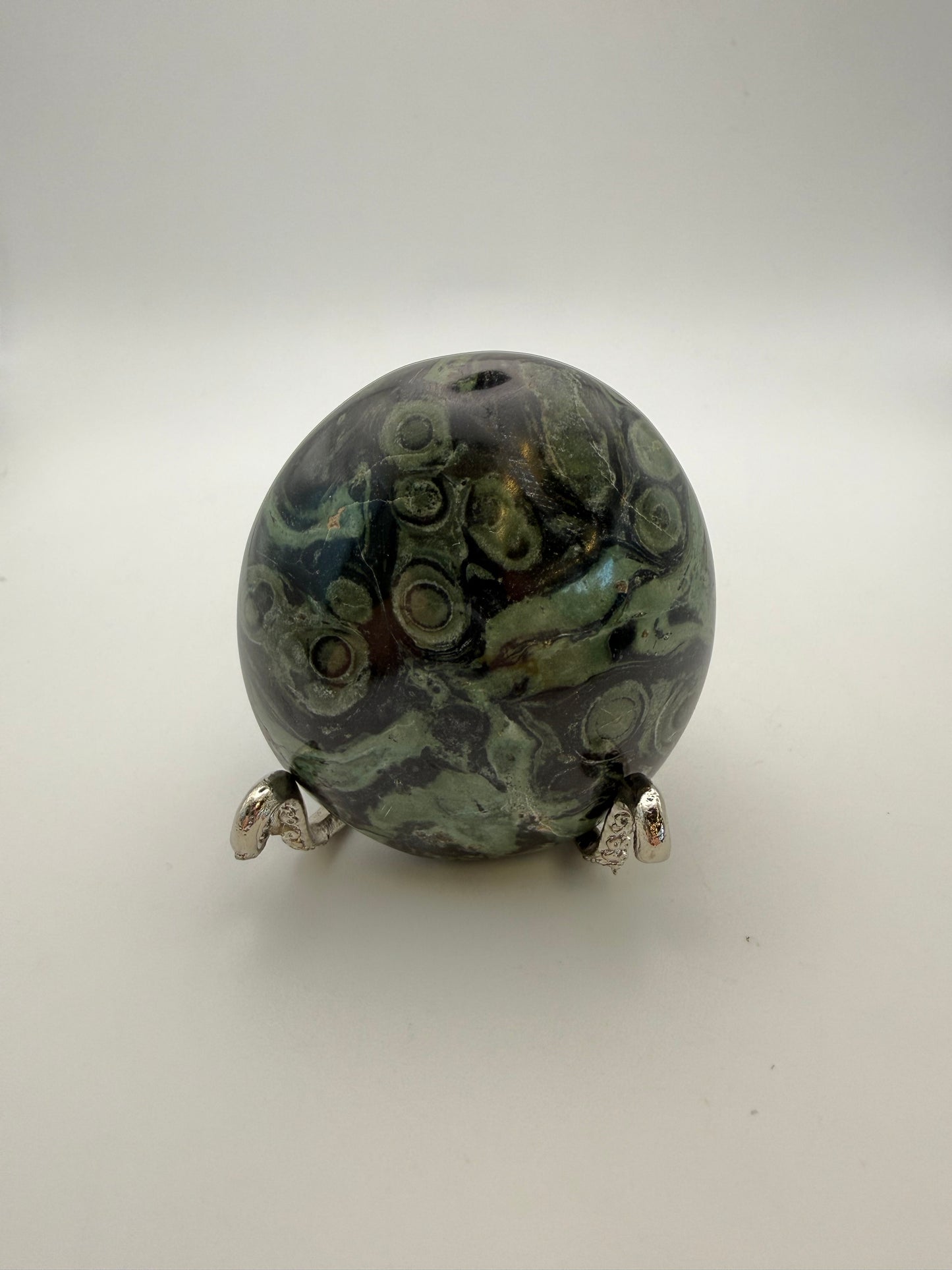 Polished kambaba jasper palm stone.