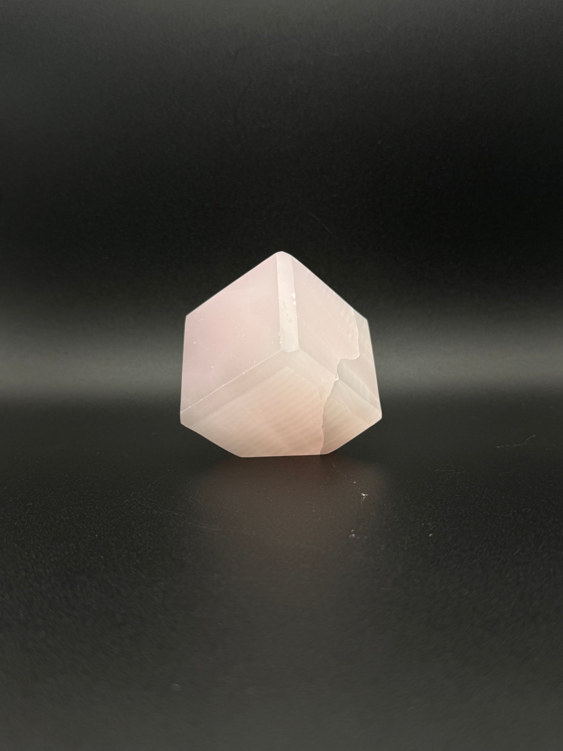 Polished Pink Calcite cut cube. Pink calcite is uv reactive.