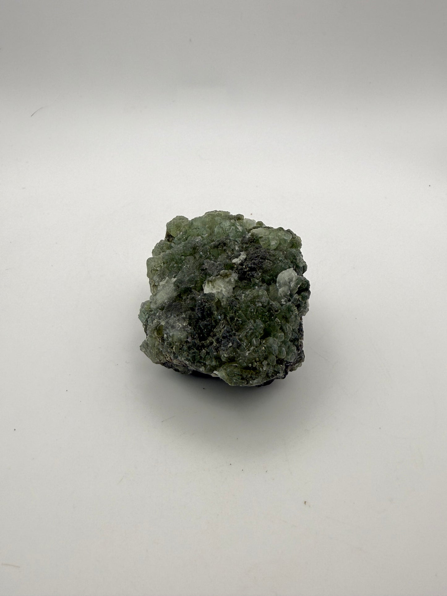 Raw Prehnite specimen with amazing green color.