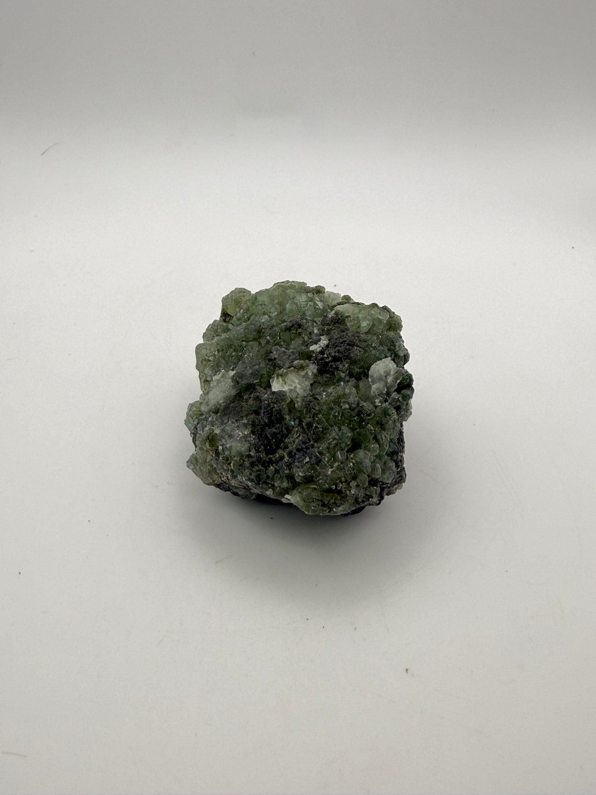 Raw Prehnite specimen with amazing green color.