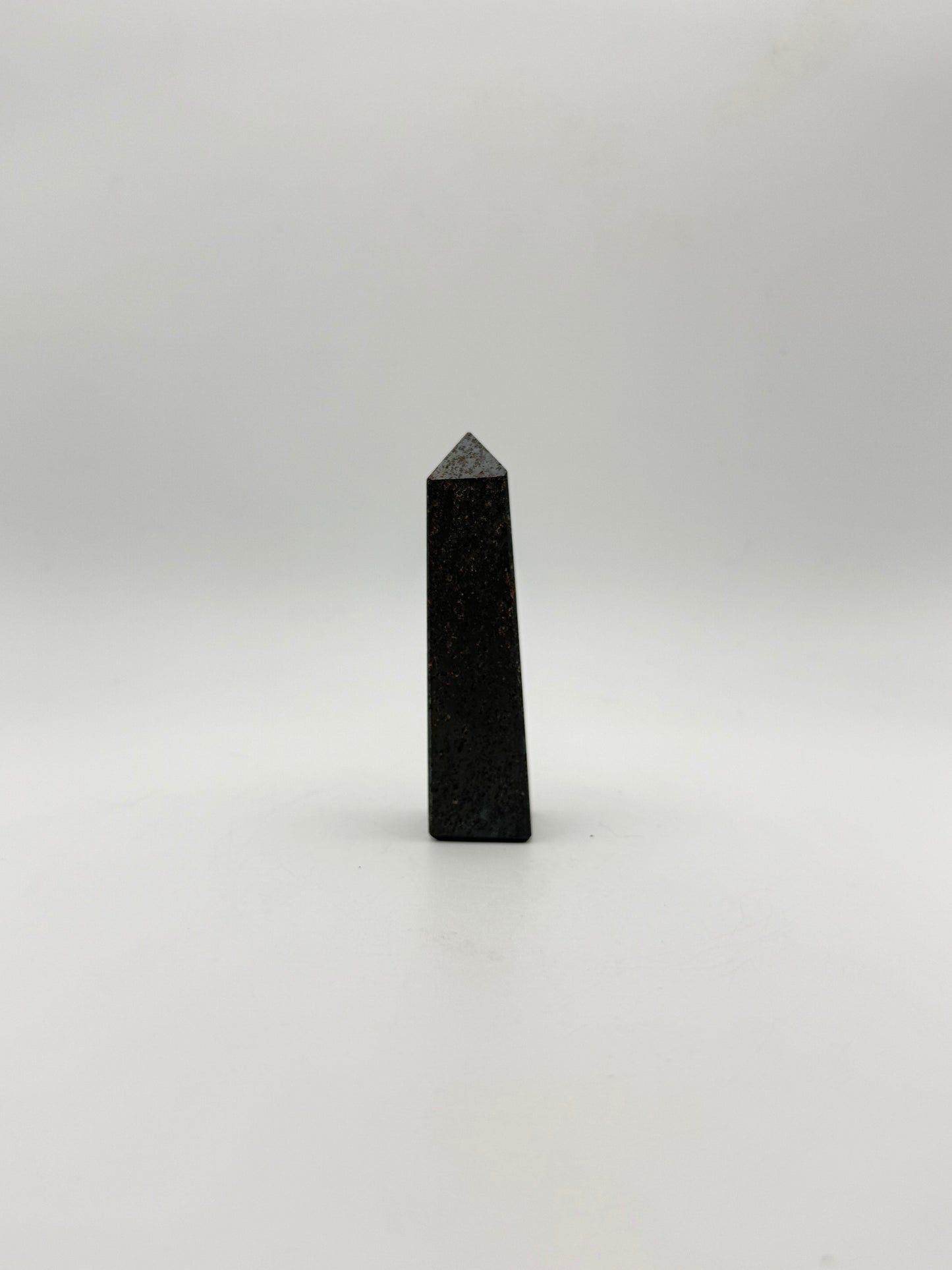 four sided hematite tower.