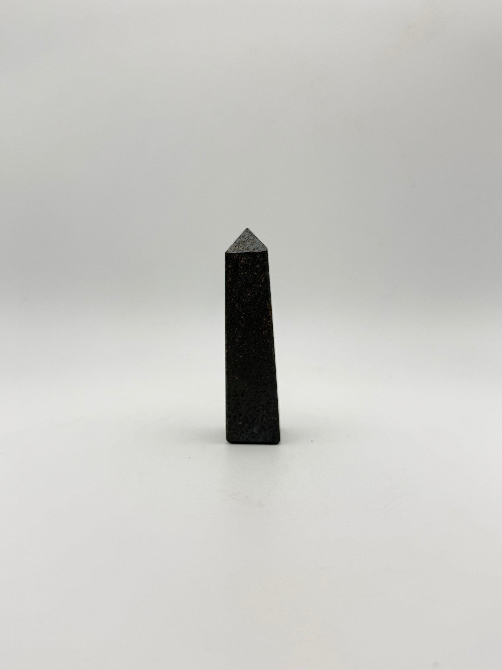 four sided hematite tower.