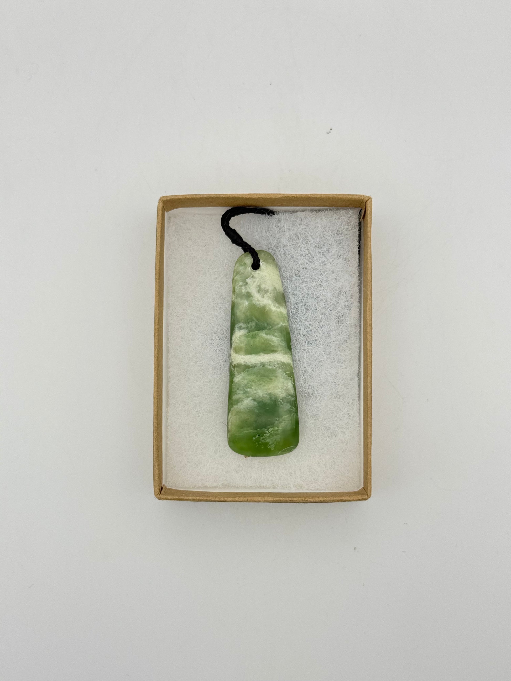 Green Jade pendant with string necklace.