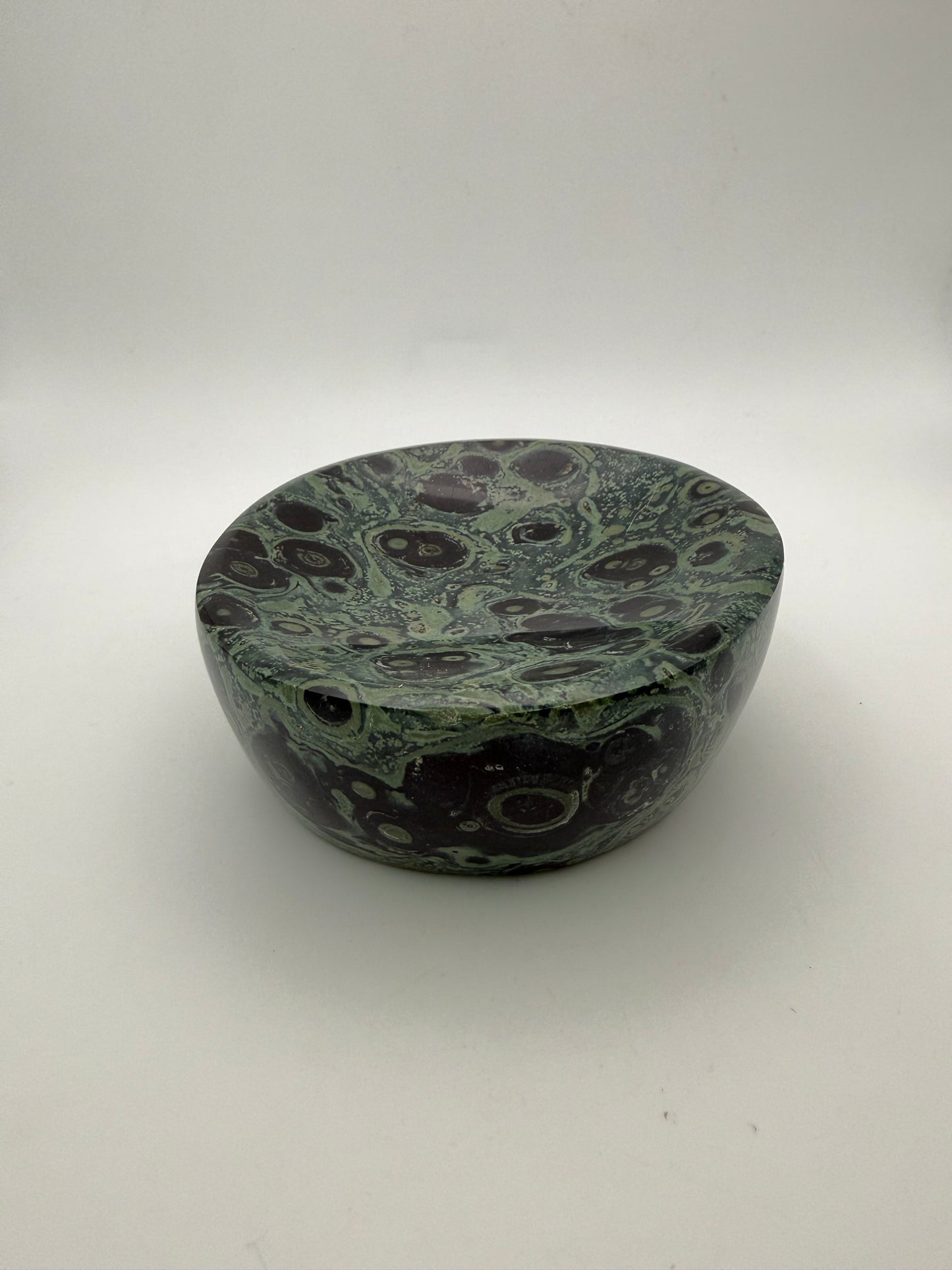 Polished kambaba jasper in the shape of a bowl.