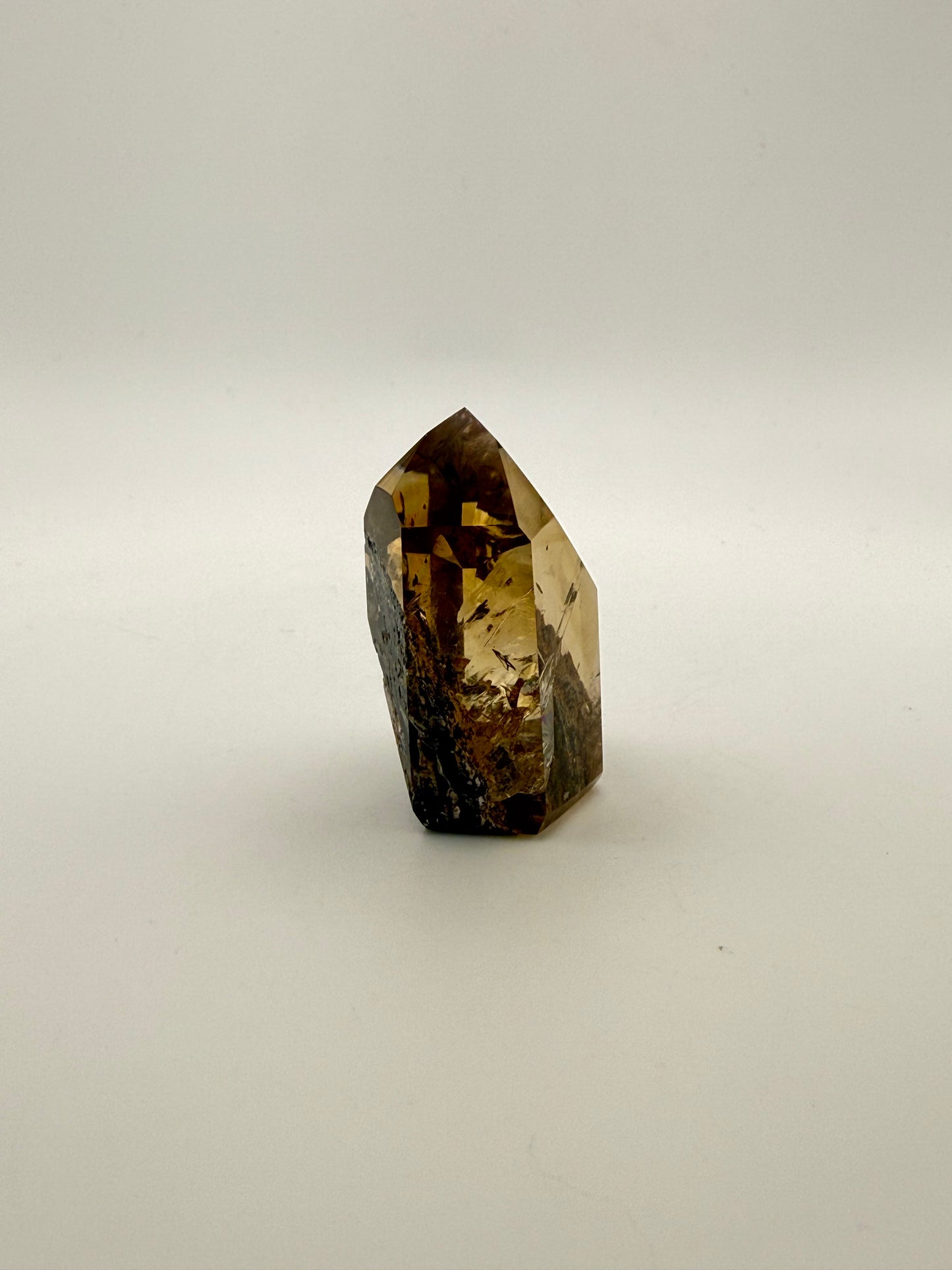 Polished natural citrine point.