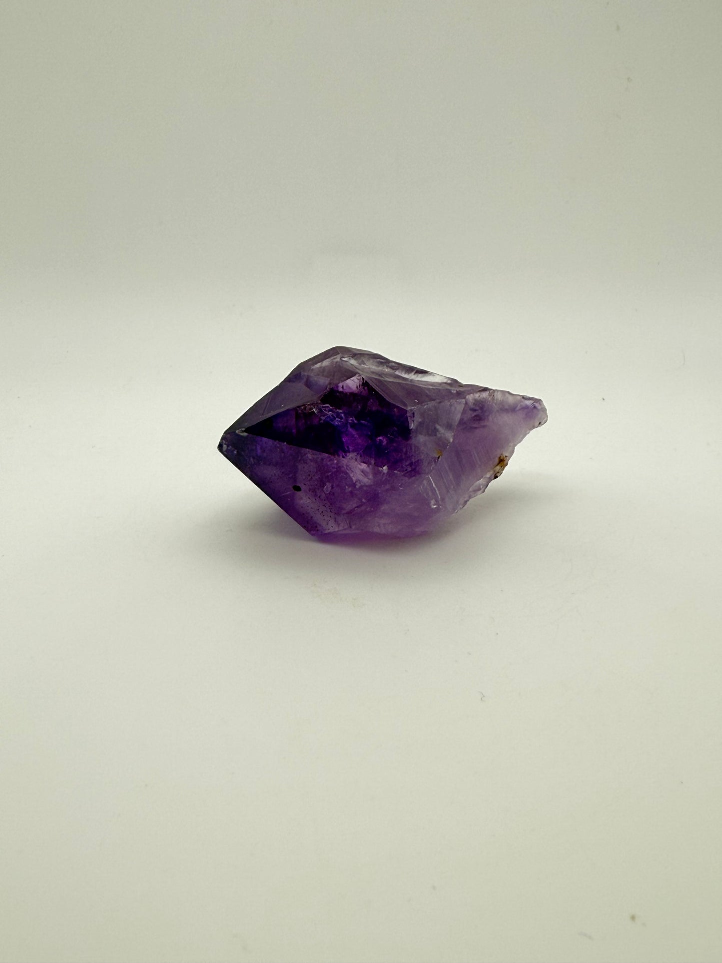 Amethyst crystal with deep purple color.